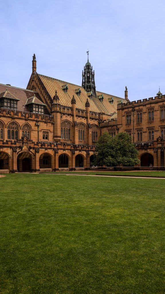 Crafting Captivating Headlines: Your awesome post title goes here The iconic sandstone architecture of the University of Sydney Quadrangle on a clear day, a symbol of academic excellence.